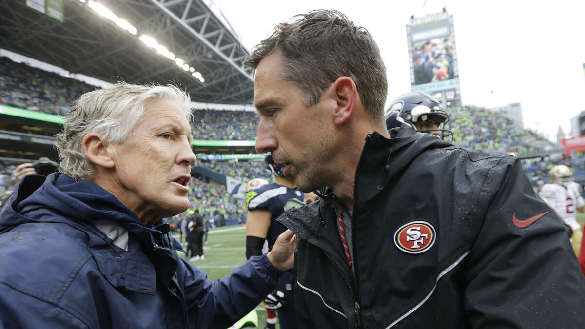 Seattle Seahawks coach Pete Carroll, left, greets 49ers coach Kyle Shanahan after a game last season. The teams, which meet Sunday in Seattle, have been polar opposites in recent years.