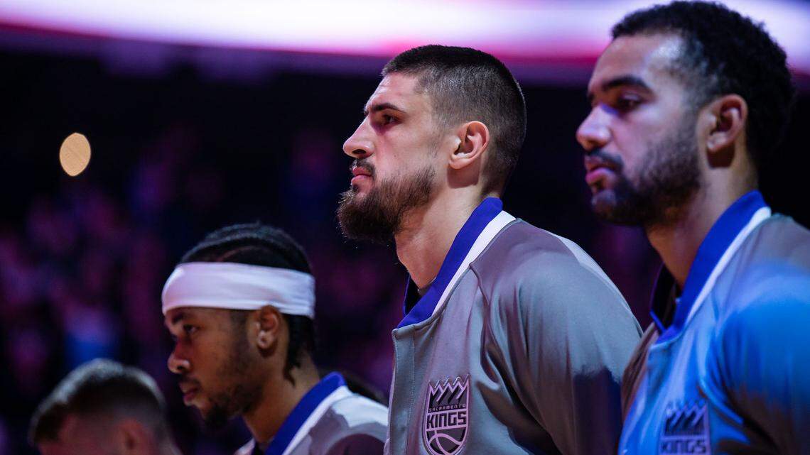Sacramento Kings center Alex Len (25) stands alongside teammates during the National Anthem before they take on the Brooklyn Nets at the NBA basketball game Tuesday, Nov. 15, 2022, at Golden 1 Center in Sacramento.