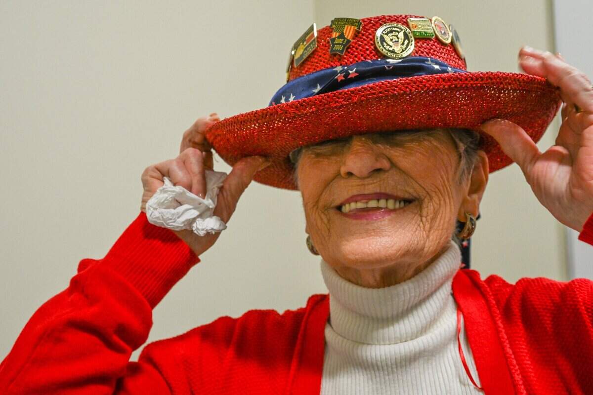 Murriel Oles, 80, jokes on Friday in Rocklin that she can’t wear the hat with election pins she has collected while working in the Placer County Elections Office. “It’s very heavy, and it’s so old that the elastic that fits my little head has all stretched out,” Oles said.