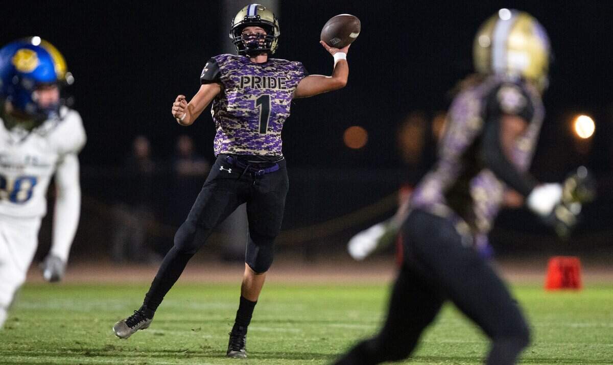 Bradshaw Christian quarterback Sam Amezcua (1) throws a completion to Carson Fitzpatrick against the Sutter Huskies in Vineyard on Friday.