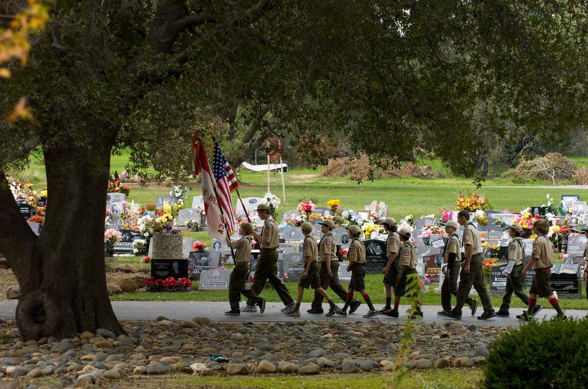 Citrus Heights Boy Scout Troop 228 honor guard led a march around Sylvan Cemetery District at the start of Veterans Day ceremony in Citrus Heights in 2009.