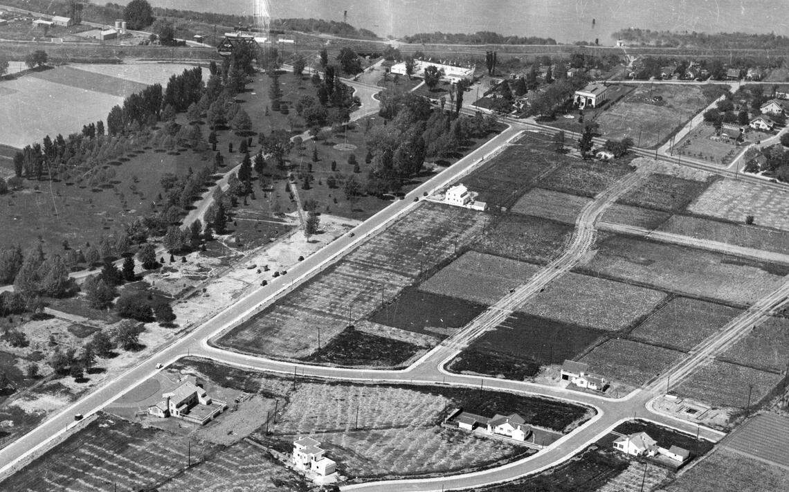 A newly opened outdoor Riverside Baths, top center, stands at the end of the western panhandle of William Land Park as the first houses in the Sacramento neighborhood are under construction in an aerial photograph from the late 1930s. The faciilty would be later be renamed the Land Park Plunge.