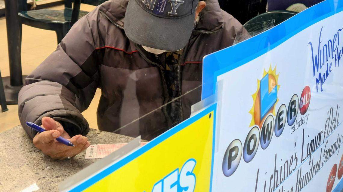 A Powerball hopeful fills out his playslip inside Lichine’s Liquor & Deli on Friday, Dec. 19, 2025. The California State Lottery has raised more than $48 billion for public schools since 1985.