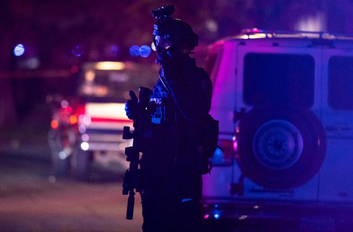 Law enforcement officers from the Sacramento County Sheriff’s Office, Sacramento Police Department and California Highway Patrol respond to a report of an officer shot Friday, Jan. 15, 2021, in Carmichael. Sacramento County sheriff’s officials said a suspect was shot and died, a Sacramento Sheriff’s deputy was shot and hospitalized and a second suspect was taken into custody.