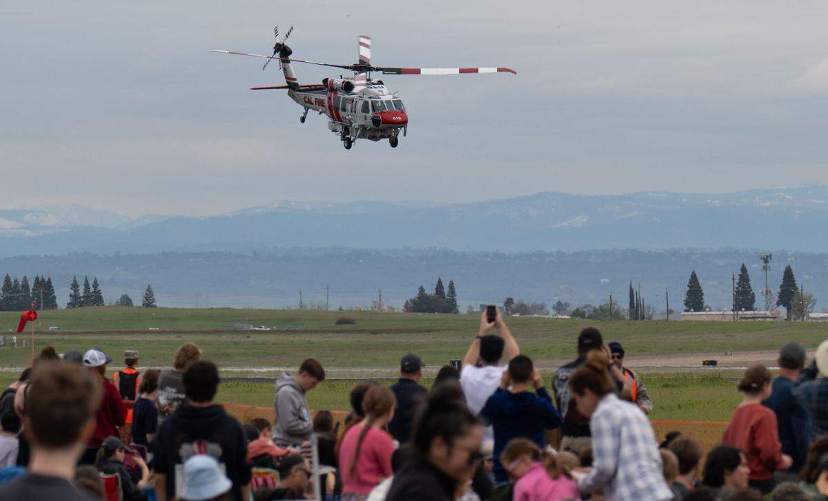 A Cal Fire Firehawk flies past the crowd at the California Capital Airshow at Mather Airport on Saturday, March 22, 2025.