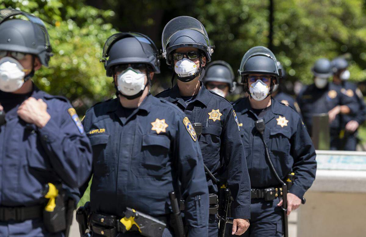 California Highway Patrol officers guard the state Capitol grounds during a protest against Gov. Gavin Newsom’s coronavirus stay-at-home order on Thursday, May 6, 2020 in Sacramento.