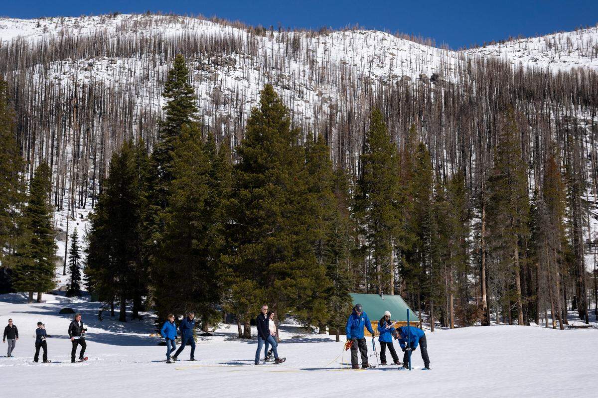 Gov. Gavin Newsom joins the Department of Water Resources for its April snow survey at Phillips Station in El Dorado County on Tuesday, April 2, 2024. The measurement of the April water content in the snowpack is 110% of normal and is a key indicator for future water supply.