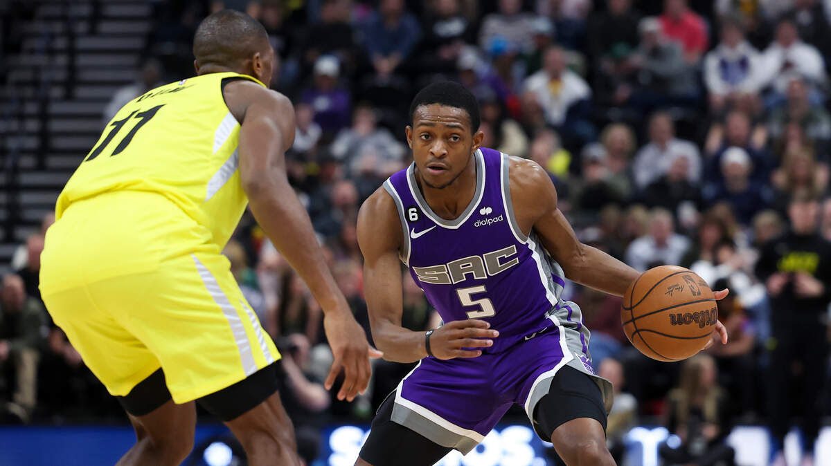 Sacramento Kings guard De’Aaron Fox (5) drives on Utah Jazz guard Kris Dunn (11) in the second quarter at Vivint Arena on Monday, March 20, 2023; Salt Lake City.