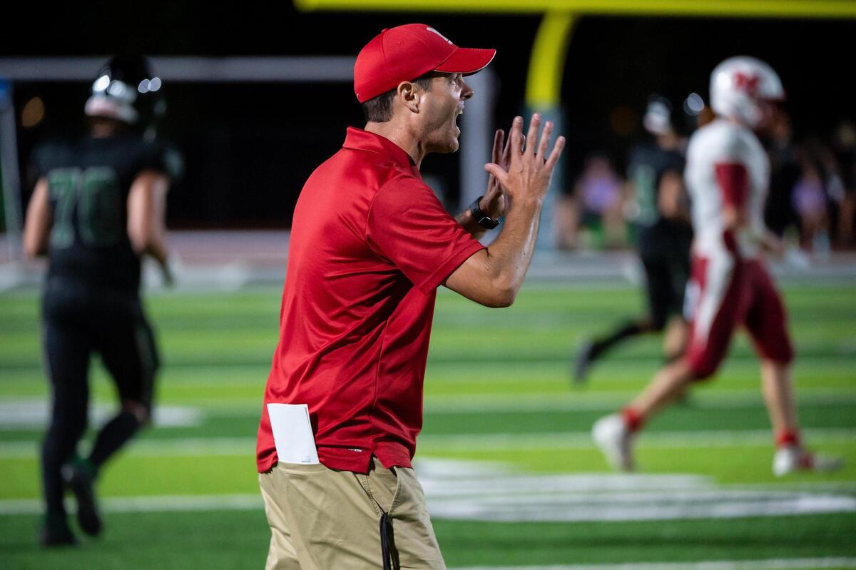 McClatchy coach Zach Cuda calls out a play with under three minutes left in the fourth quarter Friday, Aug. 19, 2022, at Twelve Bridges High School in Lincoln. The Raging Rhinos defeated the Lions 36-35.