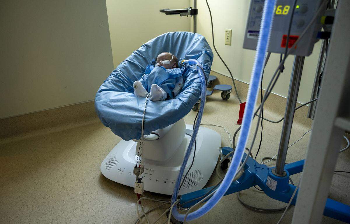 A newborn named Casey sleeps in a Mama Roos sleeper at the neonatal unit at Mercy Hospital in Citrus Heights on Nov. 22. The NICU at Mercy Hospital is asking Book of Dreams for more of the multimotion baby swings to provide comfort to newborns.