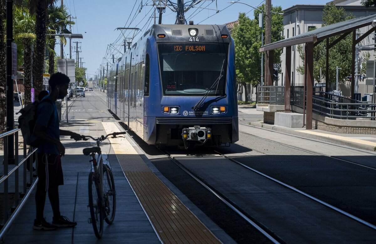 Passengers wait to board the light rail train at the 29th Street station in Sacramento on Wednesday, June 10, 2026. Sacramento Regional Transit will be making a change late this summer to the speakers that emanate the warning bell sound on the new S700 low-floor light rail vehicles.
