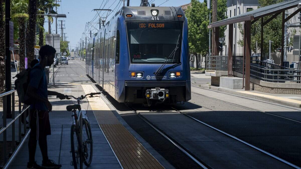 Passengers wait to board the light rail train at the 29th Street station in Sacramento on Wednesday, June 10, 2026.