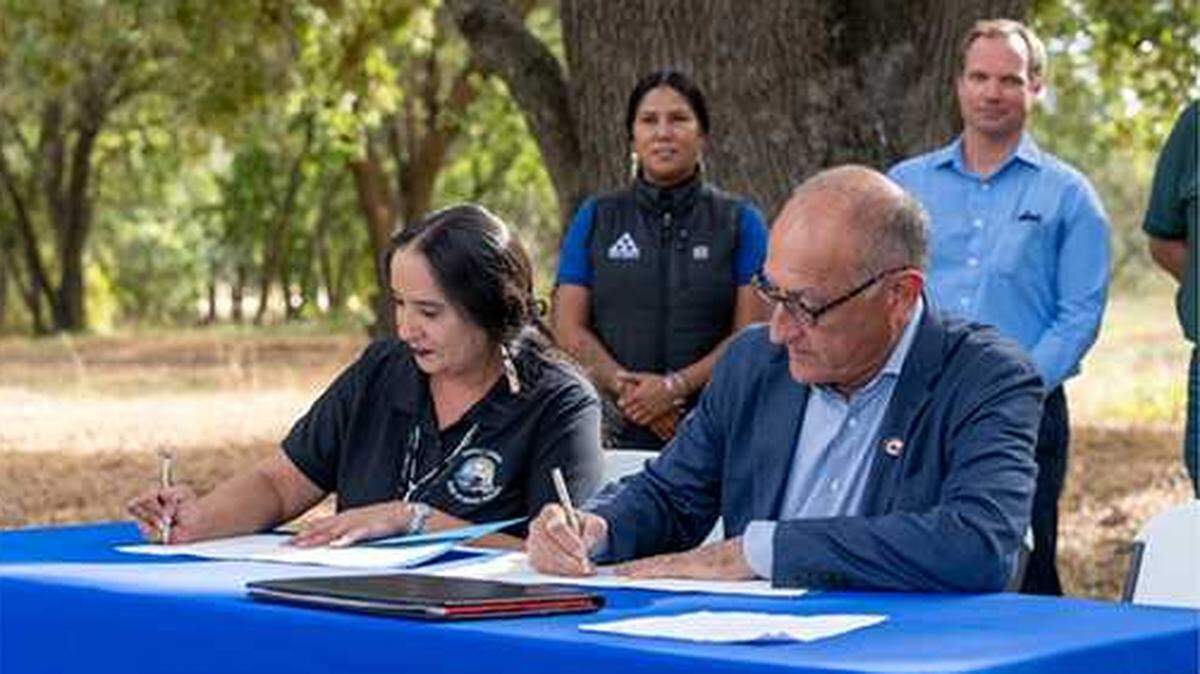 California State Parks Director Armando Quintero, right, and Shingle Springs of Miwok Indians Chairwoman Regina Cuellar sign a memorandum of understanding to preserve tribal land on Wednesday, Oct. 16, 2023.