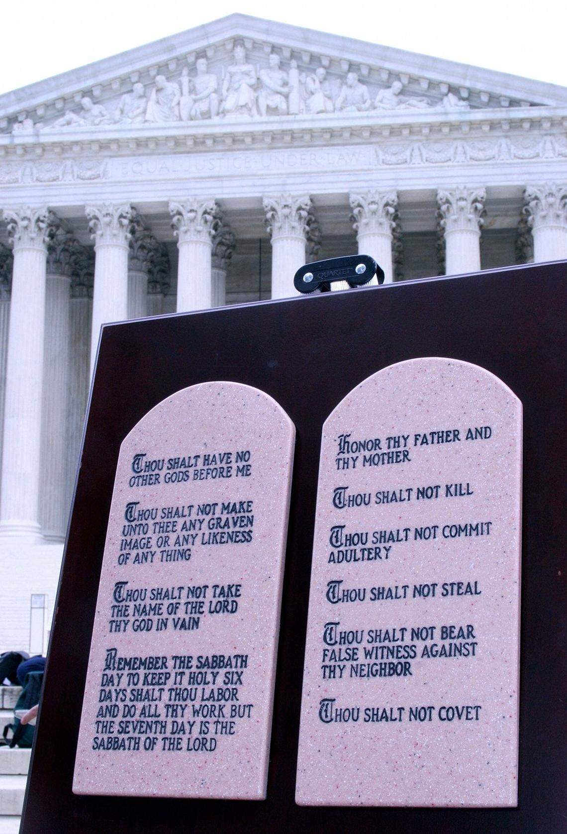 This June 27, 2005, photo shows the Ten Commandments on display outside of the US Supreme Court in Washington, D.C. A sharply divided Supreme Court earlier on June 27 upheld the constitutionality of displaying the Ten Commandments on government land, but drew the line on displays inside courthouses, saying they violated the doctrine of separation of church and state. (Karen Bleier/AFP via Getty Images/TNS)