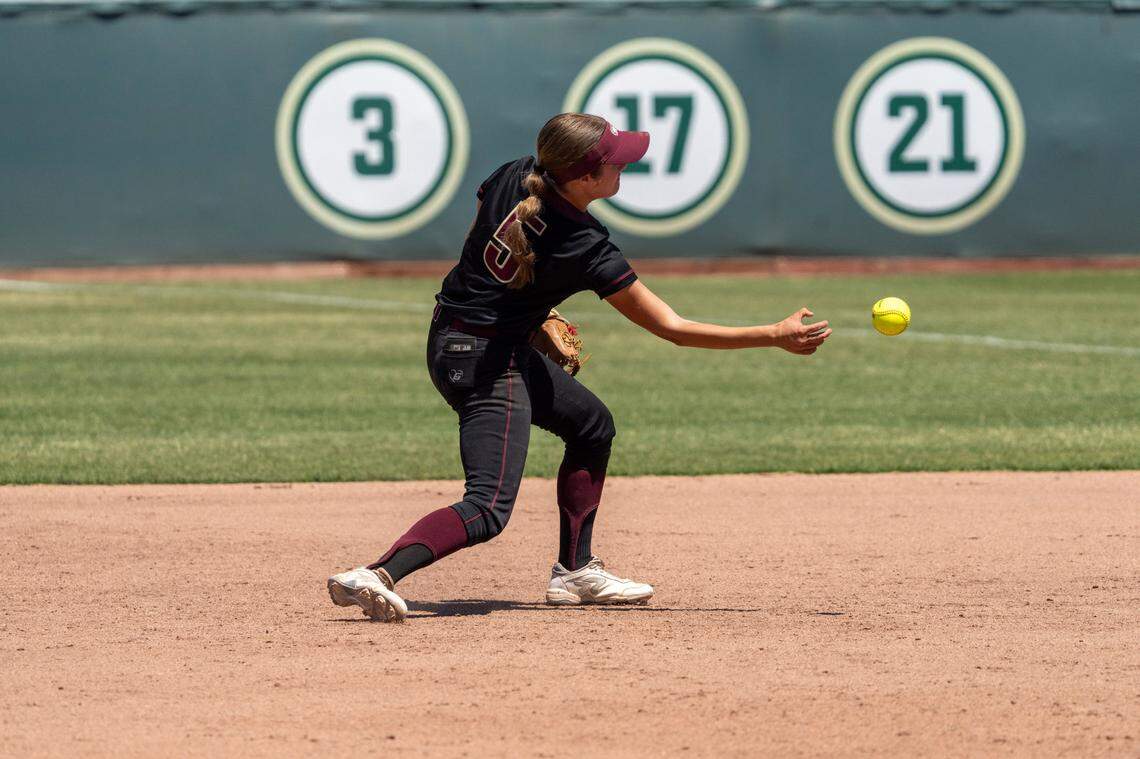 The Whitney Wildcats’ Brooklyn Steele throws to first during the CIF Sac-Joaquin Section Division II championship softball game against the Rocklin Thunder at Sacramento State on Saturday, May 24.