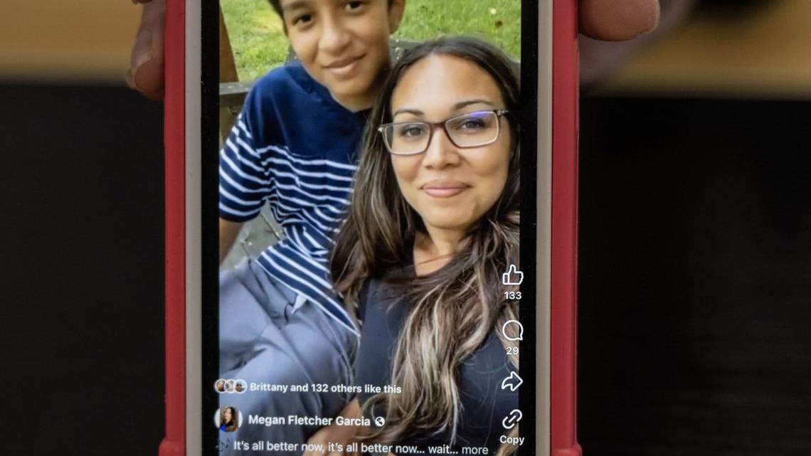 Megan Garcia holds her phone with an image of her son Sewell in New York, Oct. 13, 2024. Sewell Setzer, 14, committed suicide, spurred by his unhealthy relationship with an AI chatbot, his family said.