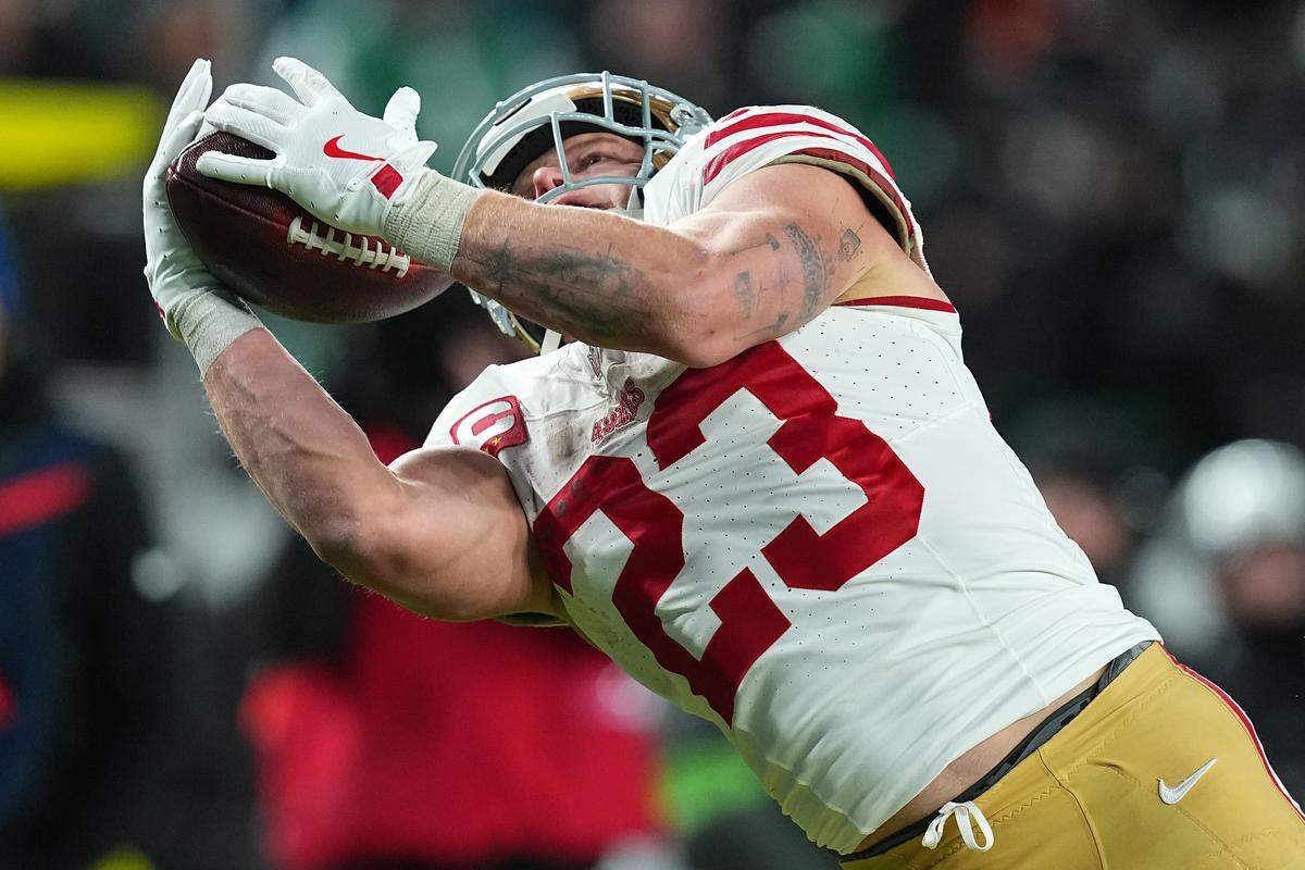 PHILADELPHIA, PENNSYLVANIA - JANUARY 11: Christian McCaffrey #23 of the San Francisco 49ers catches a touchdown against the Philadelphia Eagles during the fourth quarter in the NFC Wild Card Playoff game at Lincoln Financial Field on January 11, 2026 in Philadelphia, Pennsylvania. (Photo by Mitchell Leff/Getty Images)