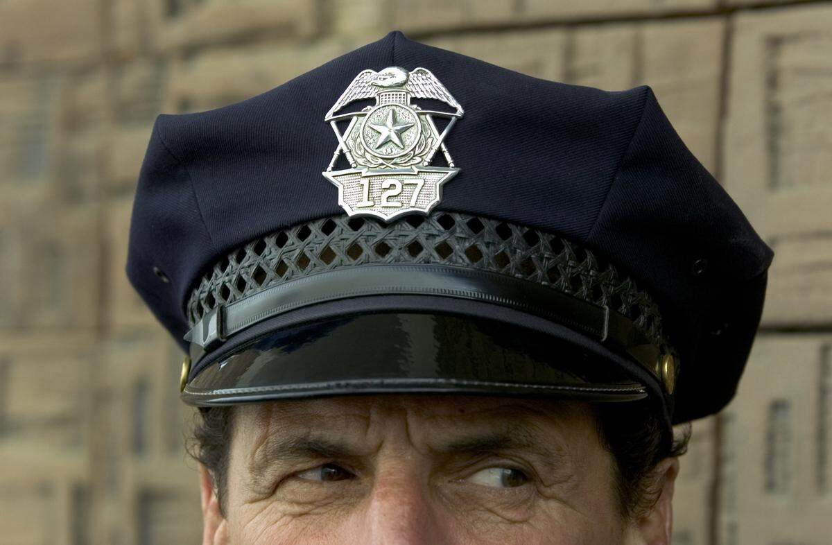 Officer Billy Lyons wears a hat badge in 2006 that his father Kenneth Lyons wore as a Sacramento police officer. Kenneth got the badge from his friend, Sacramento Police Officer John Strazo, who worked for the department in the early 1900s. Billy, who is retiring soon, has been with the Sacramento Police Department for 42 years.