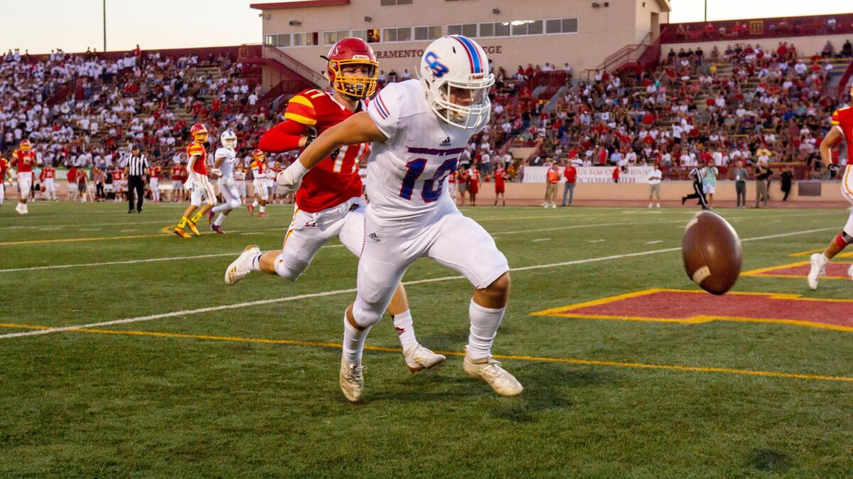 Jesuit Marauders’ Christian Sanchez (17) defends a pass intended for Christian Brothers’ Luke Jones (10) in the end zone as the Jesuit Marauders face the Christian Brothers Falcons in the Holy Bowl at Hughes Stadium at Sacramento City College on Saturday, Sept. 14, 2019.