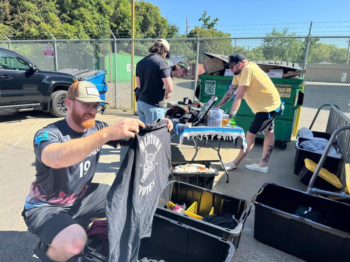 Kellen McConnell, far right, sells his brand called Sacramento Hates You Too at a recent pop up behind Club Raven in downtown Sacramento on May 24, 2024.