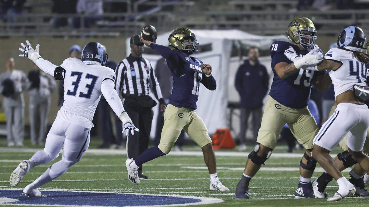 UC Davis Aggies quarterback Caden Pinnick (12) throws the ball in the first quarter of a second-round NCAA Division FCS playoff game against the Rhode Island Rams at UC Davis Health Stadium on Saturday.