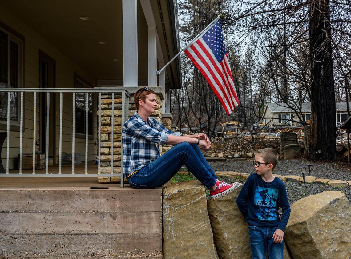 Dawn Herr and her son Liam, 8, on a March visit to their Paradise home that survived the Camp Fire.
