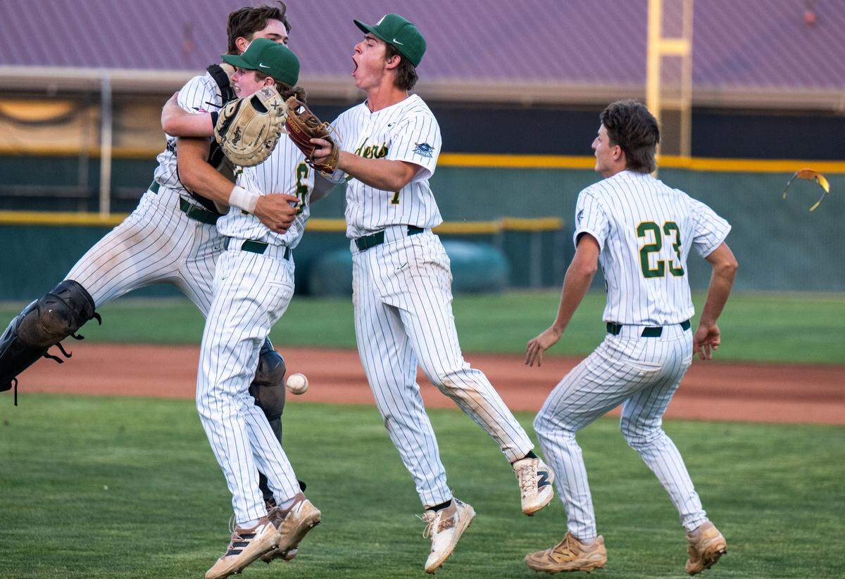 Rio Americano Raiders Everett Filippo, left, Conor Flynn (6), Braden Leu (7) and Luke Rolli (23) celebrate their CIF Sac-Joaquin Division III baseball championship win against the El Capitan Gauchos after the final out at Sacramento City College on Wednesday, May 20, 2026.