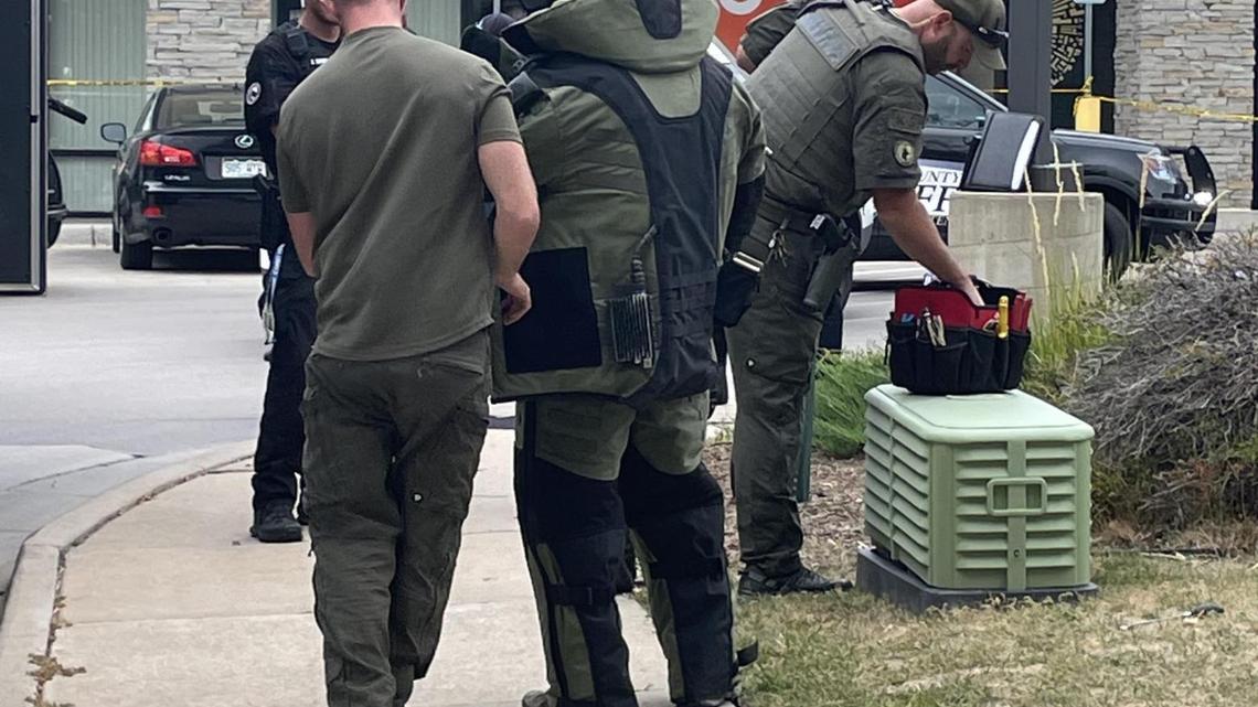 Arapahoe Sheriff Bomb Squad technicians investigate what turned out to be an “actual” pipe bomb near a Colorado Safeway.