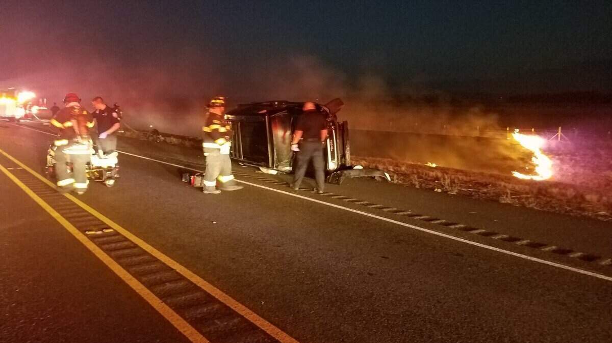 Emergency personnel on scene of a multivehicle crash on Highway 65 in Lincoln, which sparked a grass fire Tuesday, Aug. 9, 2018.