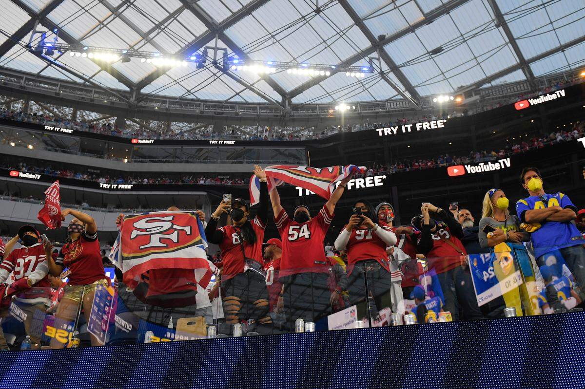 San Francisco 49ers fans celebrate after a 27-24 overtime win against the Los Angeles Rams in Inglewood on Jan. 9. The team’s strong support in the stadium took some by surprise.