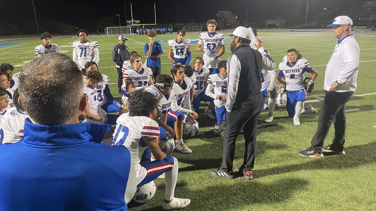 Christian Brothers coach Larry Morla, center, challenged his team to play better following a 42-19 win over Capital Christian on Friday, Sept. 30, 2023.