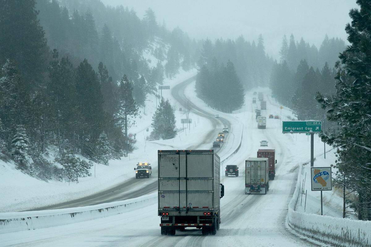 Vehicles drive slowly during chain control in eastbound I-80 Wednesday, Jan. 27, 2021, near Emigrant Gap.