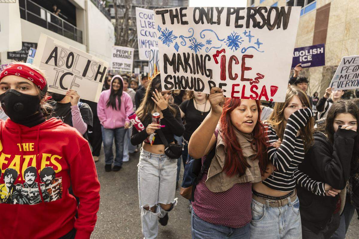 Students march from the John E. Moss Federal Building back to the state Capitol in Sacramento during a protest against ICE on Friday.