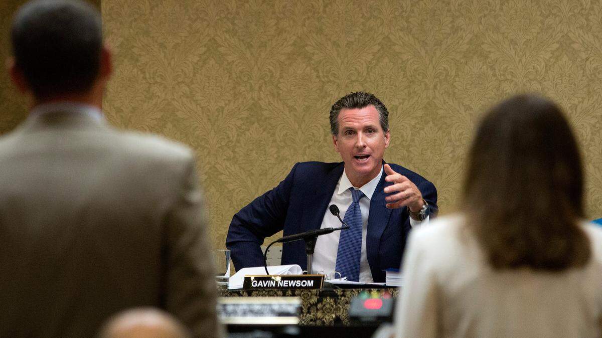 California Lt. Gov. Gavin Newsom, center, a member of the State Lands Commission, questions Erich Pica, president of Friends of the Earth, left, and Geisha Williams, president of electric for Pacific Gas & Electric, about the closure of the Diablo Canyon Nuclear Power, Tuesday, June 28, 2016, in Sacramento, Calif.