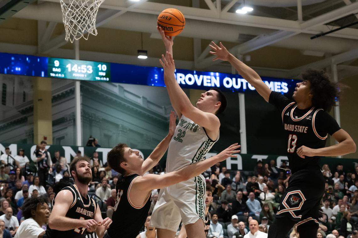 Sacramento State Hornets forward Mark Lavrenov drives over Idaho State Bengals forward Connor Hollenbeck during a game at Sacramento State on Monday.