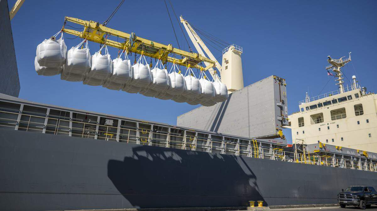 Bags of rice are lifted onto a ship in the Port of West Sacramento on Thursday, July 31, 2025.