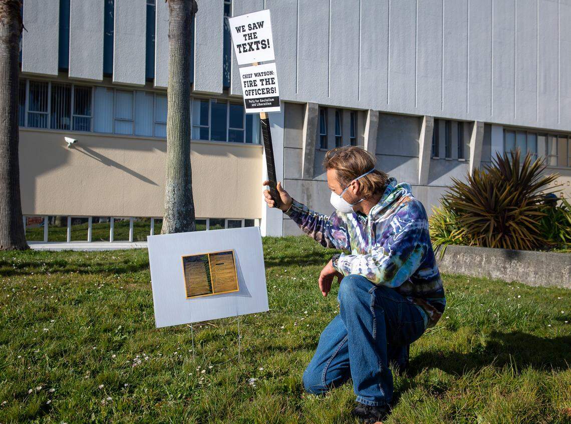 Abner Carlisle-Roy reads offensive text messages from Eureka Police officers, printed from The Bee’s website, on March 26, 2021, at a protest at the Humboldt County Courthouse demanding that the officers be fired.