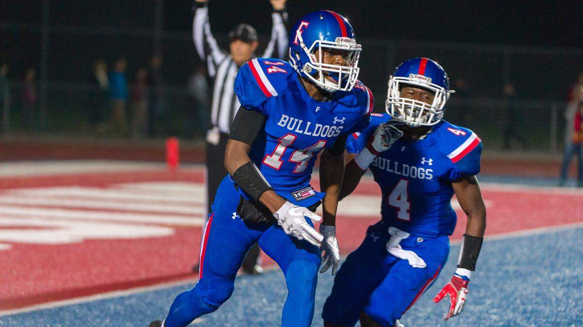 Folsom’s Elijhah Badger, left, celebrates with Daniyel Ngata during a 2017 playoff game. They are both seniors and national recruits heading into this season.