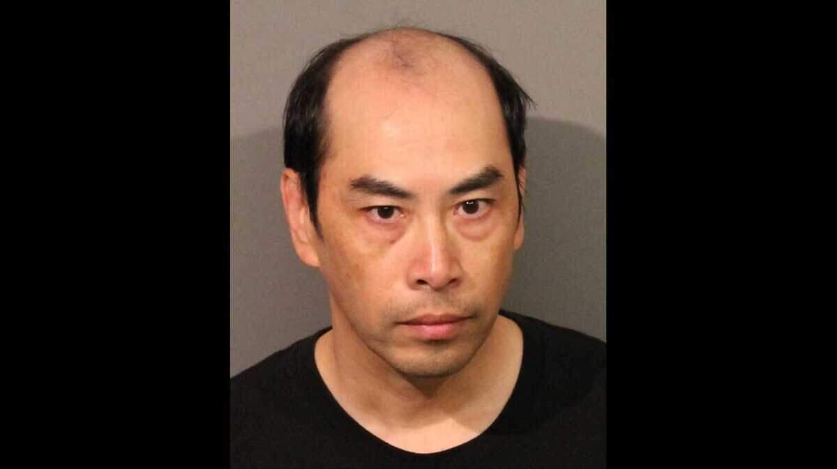 Wen Jie Huang, 50, was arrested Thursday after he allegedly sent threatening text messages to his neighbors containing images of a gun and ammunition, the Roseville Police Department said.
