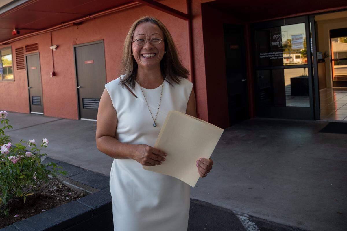 Kathy Chao Rothberg, executive director of Lao Family Community Development, stands on Sept. 10 at a complex on Watt Avenue in Arden Arcade that her group recently purchased. She is hoping to make it into a facility that can house refugees and give them support services.