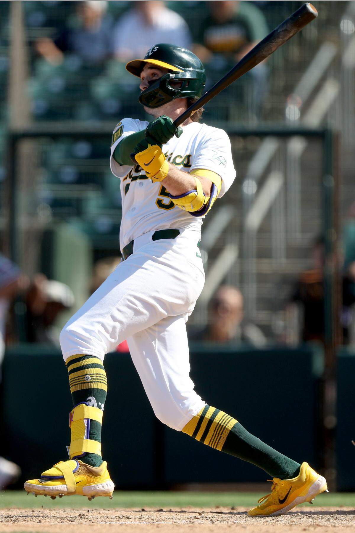 Athletics shortstop Jacob Wilson (5) hits a two-RBI double against the Texas Rangers during the eighth inning at Sutter Health Park.
