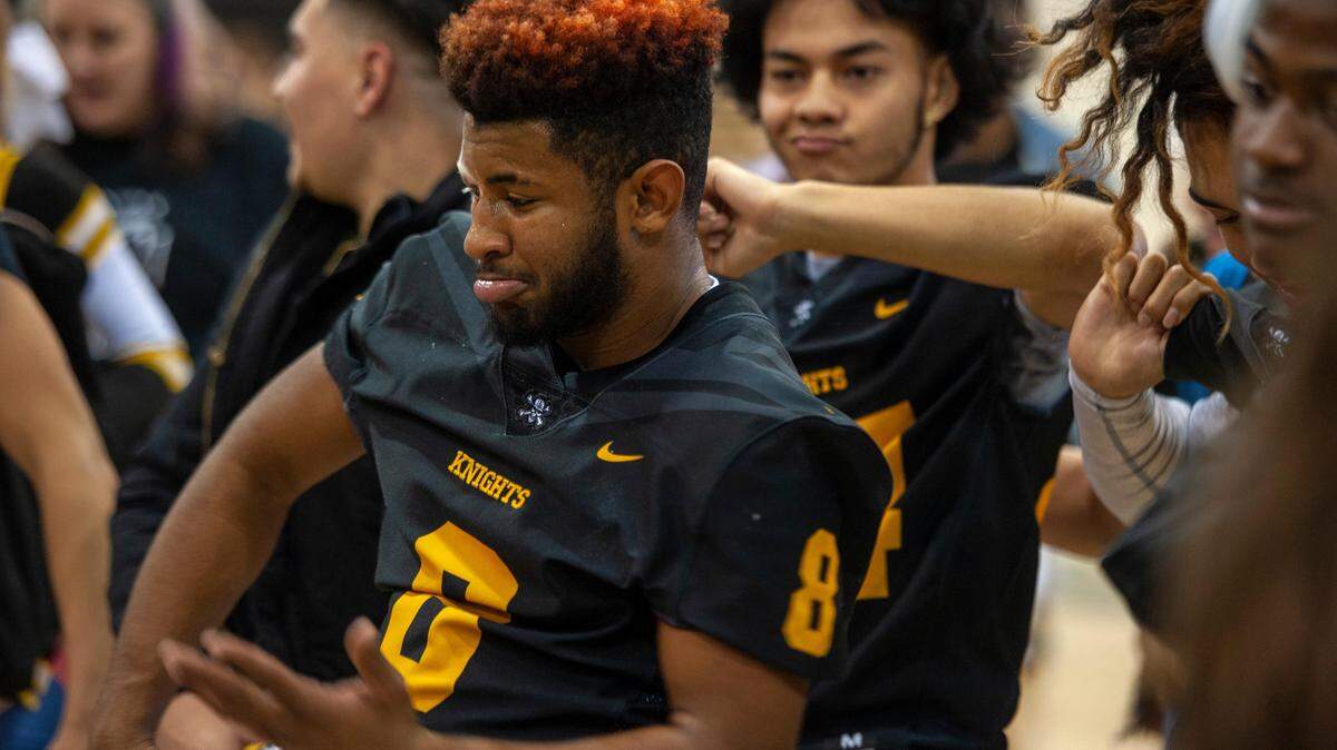 Rio Linda High School football player Abraham Banks (8) celebrates with classmates Friday, Dec. 14, 2018, at a rally before the school’s first state championship game in any sport.