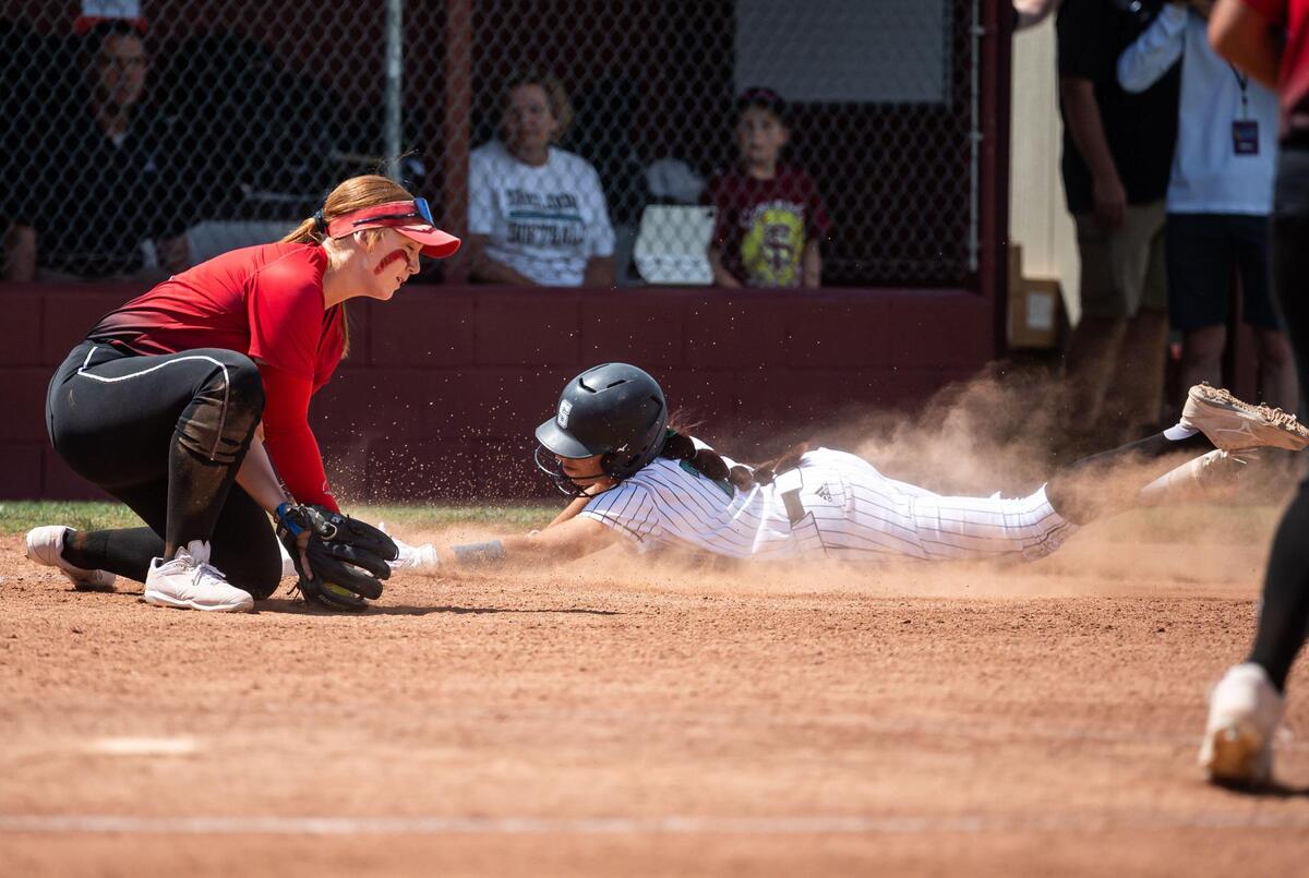 Sheldon’s Reina Zermeño slides in for a triple past a tag from Lincoln’s Daniella Hunter in the bottom of the fifth inning at the Sac-Joaquin Section Division I title softball game Saturday at Sacramento City College. Sheldon beat Lincoln of Stockton 7-1.