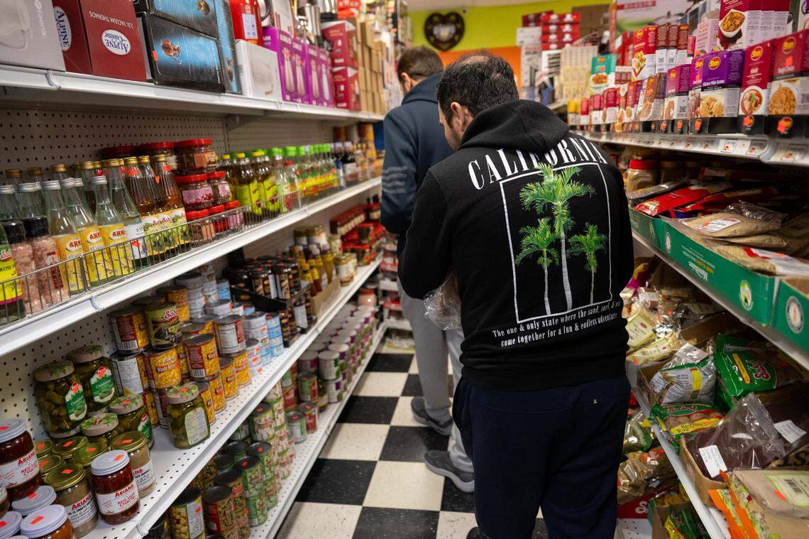 Recent refugees shop for food at Noble Halal Grocery in January. They entered the U.S. less than one week before President Donald J. Trump signed an executive order suspending the U.S. Refugee Admissions Program.