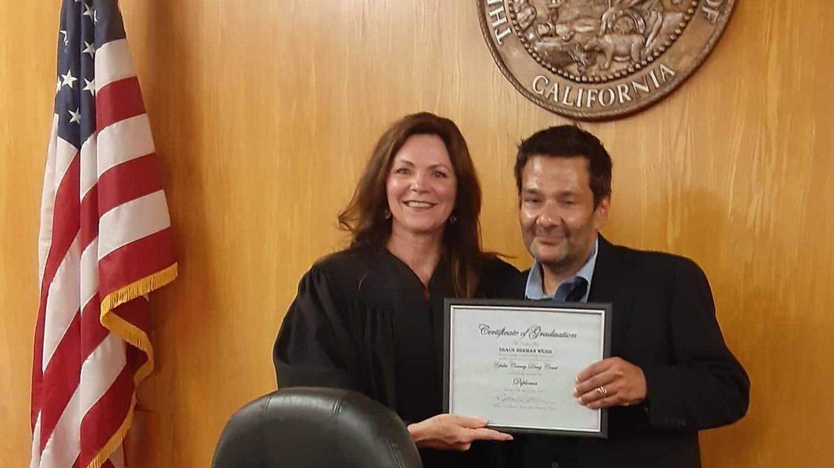Former child actor Shaun Weiss is shown with Yuba County Superior Court Judge Debra Givens. He recently completed a county drug court program.