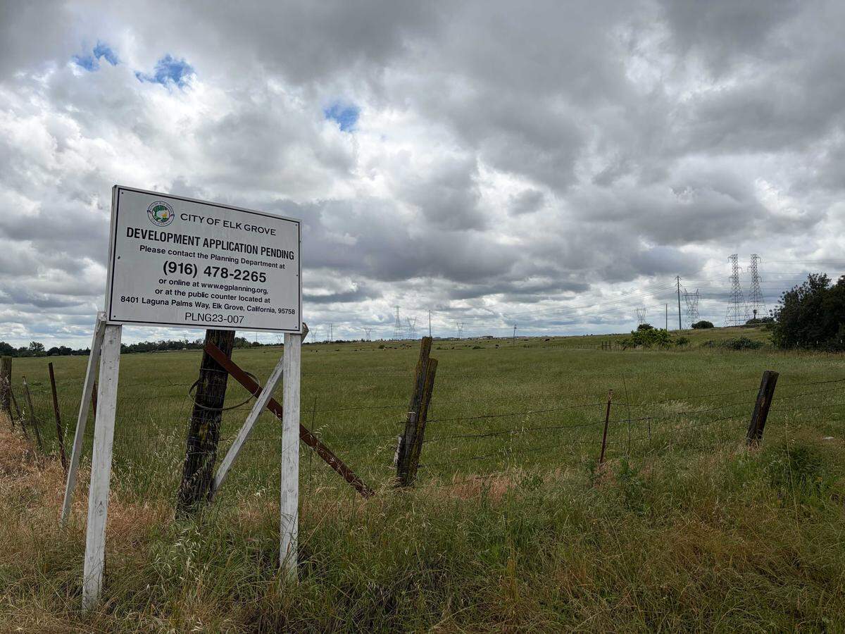 A sign showing a development proposal pending sits on the land of the potential Summer Villas project southeast of the Sheldon Road and Waterman Road intersection on Wednesday, April 22, 2026. The development would have up to 499 senior homes in rural Elk Grove and seeks to change the city's general plan.