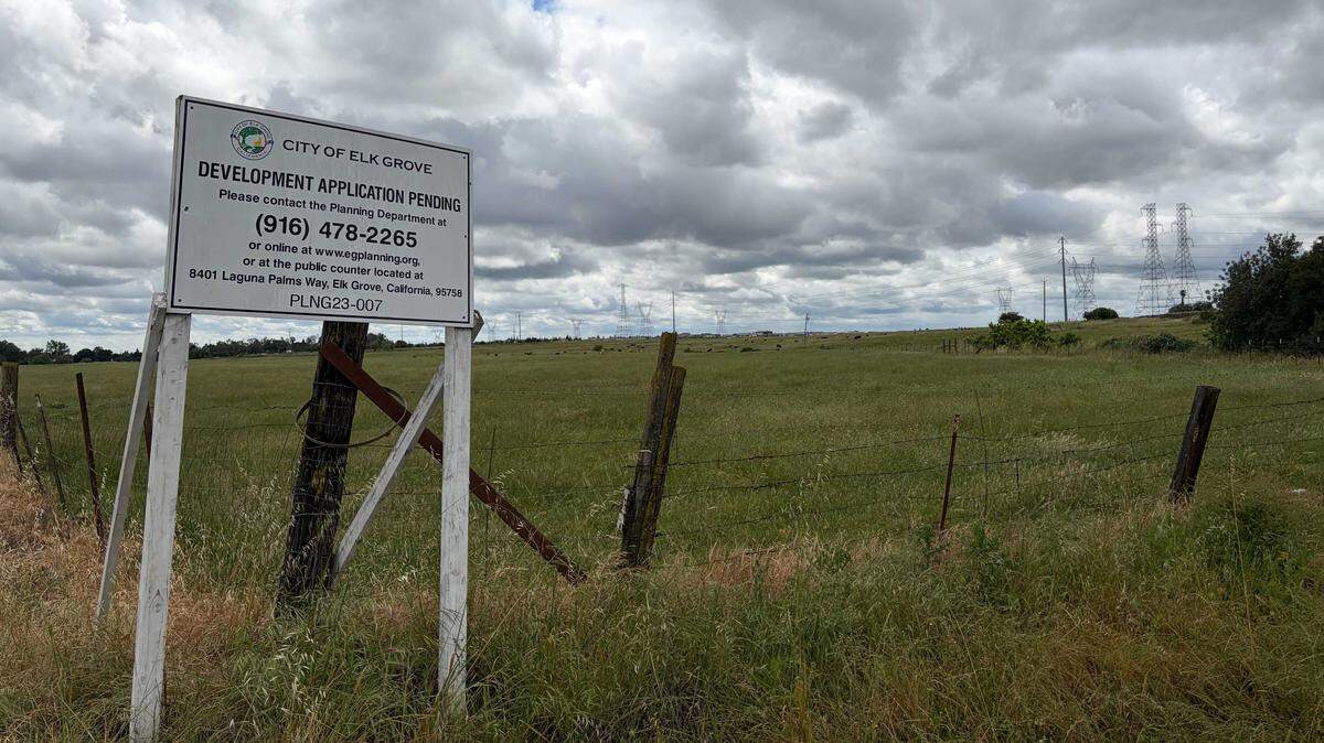 A sign showing a development proposal pending sits on the land of the potential Summer Villas project southeast of the Sheldon Road and Waterman Road intersection on Wednesday, April 22, 2026. The development would have up to 499 senior homes in rural Elk Grove and seeks to change the city's general plan.