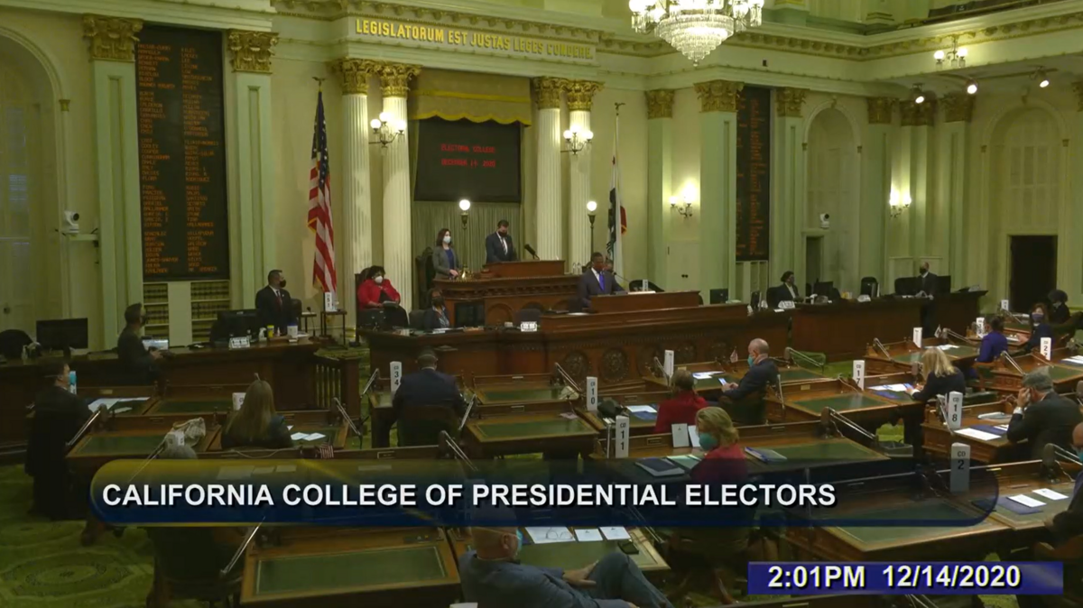 A screenshot shows California’s electors meeting in Sacramento.