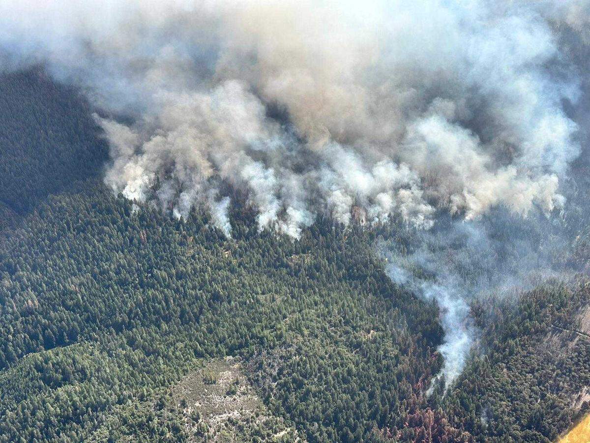 An aerial view of the Crozier Fire burning in El Dorado County, which started early Aug. 6, 2024, northeast of Placerville. On Tuesday, Cal Fire announced an arrest of a man accused of starting the blaze.