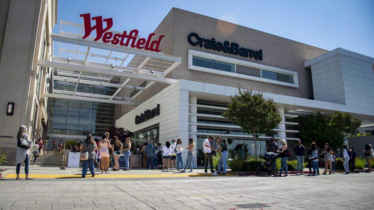 Shoppers line up outside of the Westfield Galleria Mall in Roseville in 2020. Detectives on Tuesday were investigating two armed robberies in the mall parking lot that targeted victims with “high-value items,” Roseville police said in a news release.